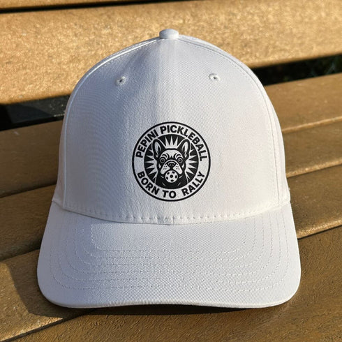 White cap with a black logo on a wooden surface